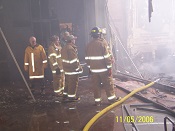 Fire fighters on the stage looking for hot spots